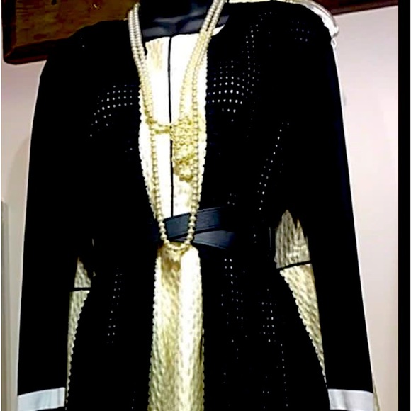 SLIGHTLY WORN BLACK BELOW THE KNEE JACKET WITH WHITE TRIM. - Picture 1 of 1